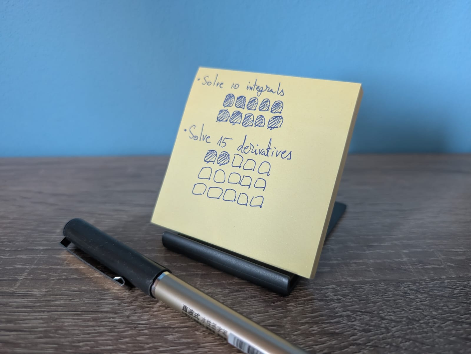 A picture of my simple atomic tasks system using a stack of sticky notes